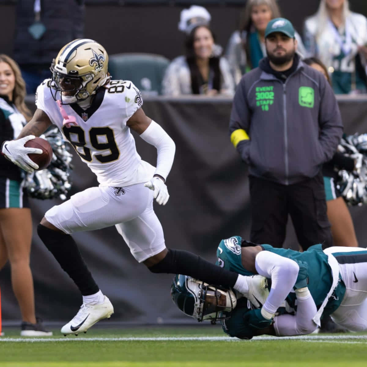 Saints Player Evades Tackle During Game Wallpaper