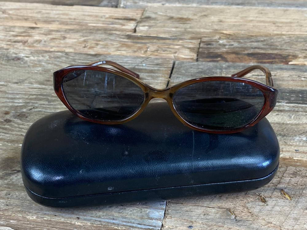 Saks Fifth Avenue Brown Sunglasses Background