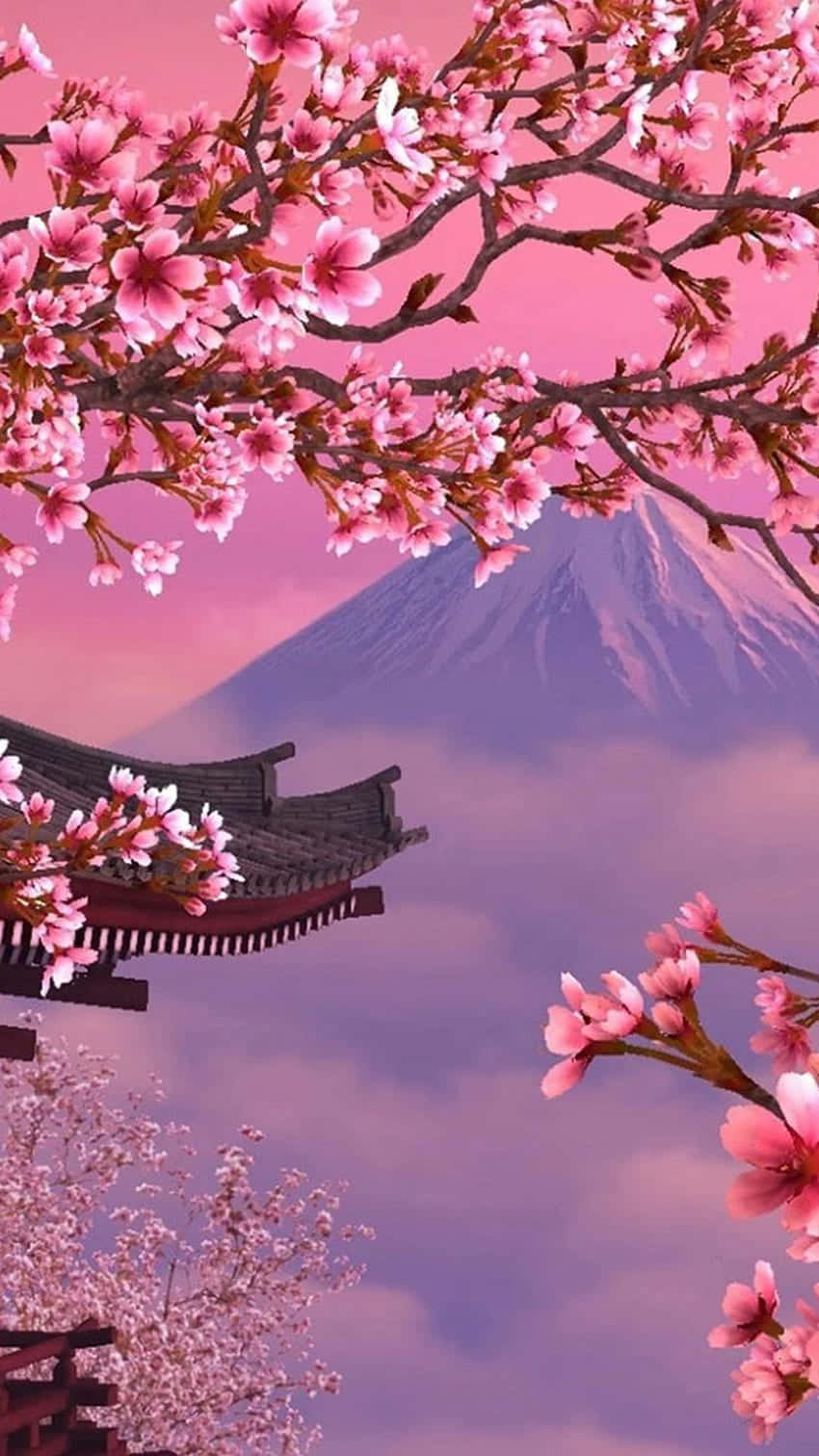 A Pink Blossoming Tree With A Mountain In The Background Wallpaper
