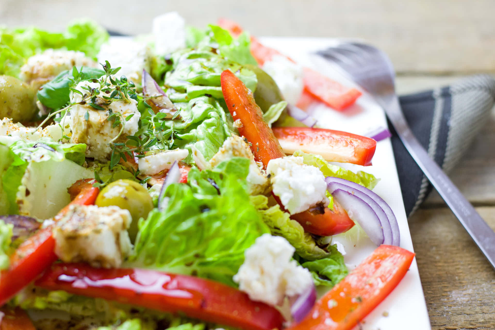 A delicious mix of greens, vegetables, and dressing for a healthy and full meal