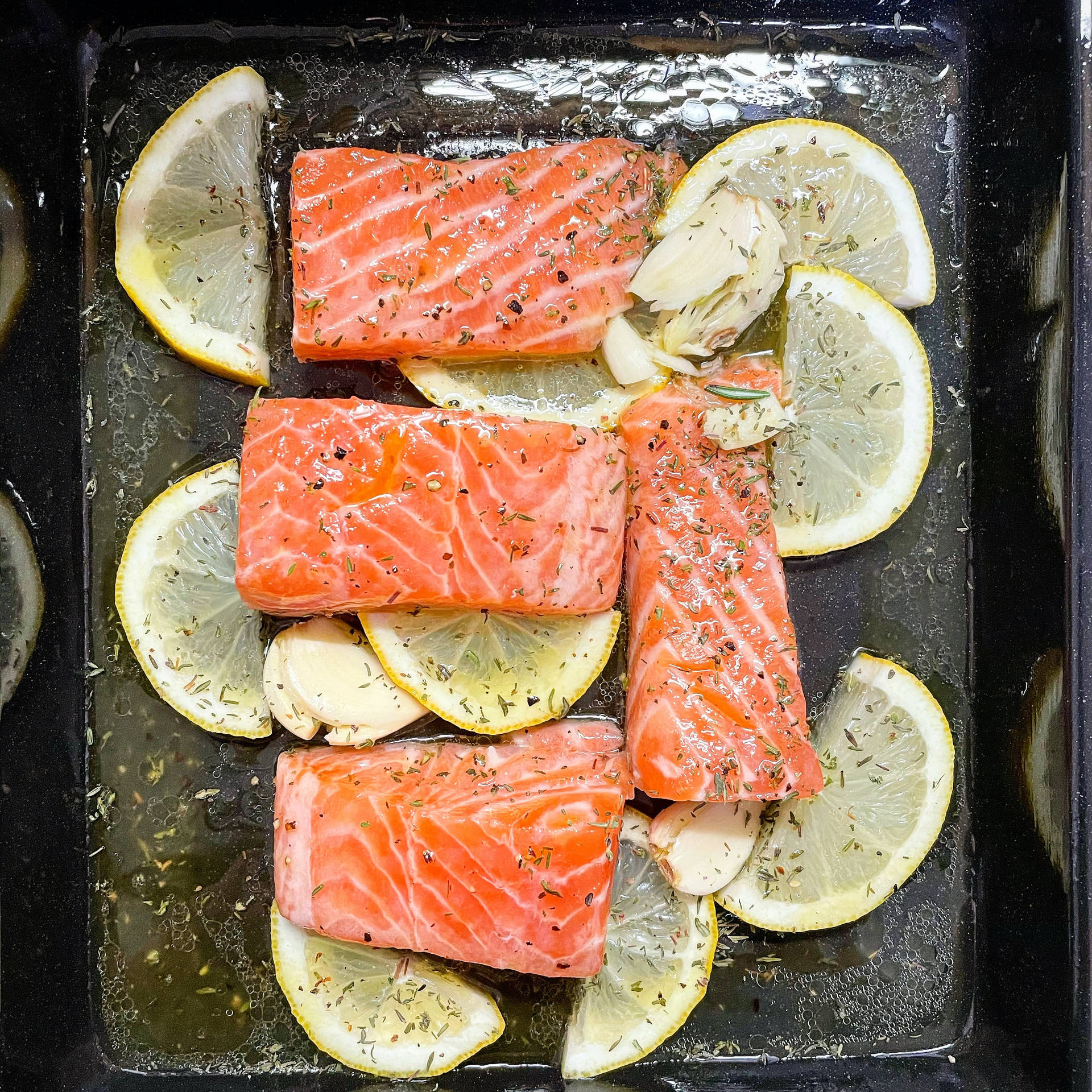 Salmon And Lemon Slices On Tray Wallpaper