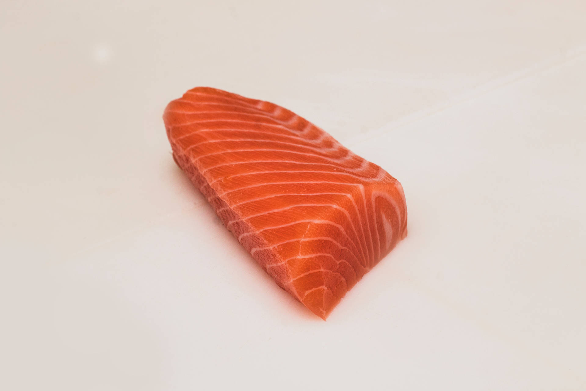 Salmon Raw Slice On Plain White Wallpaper