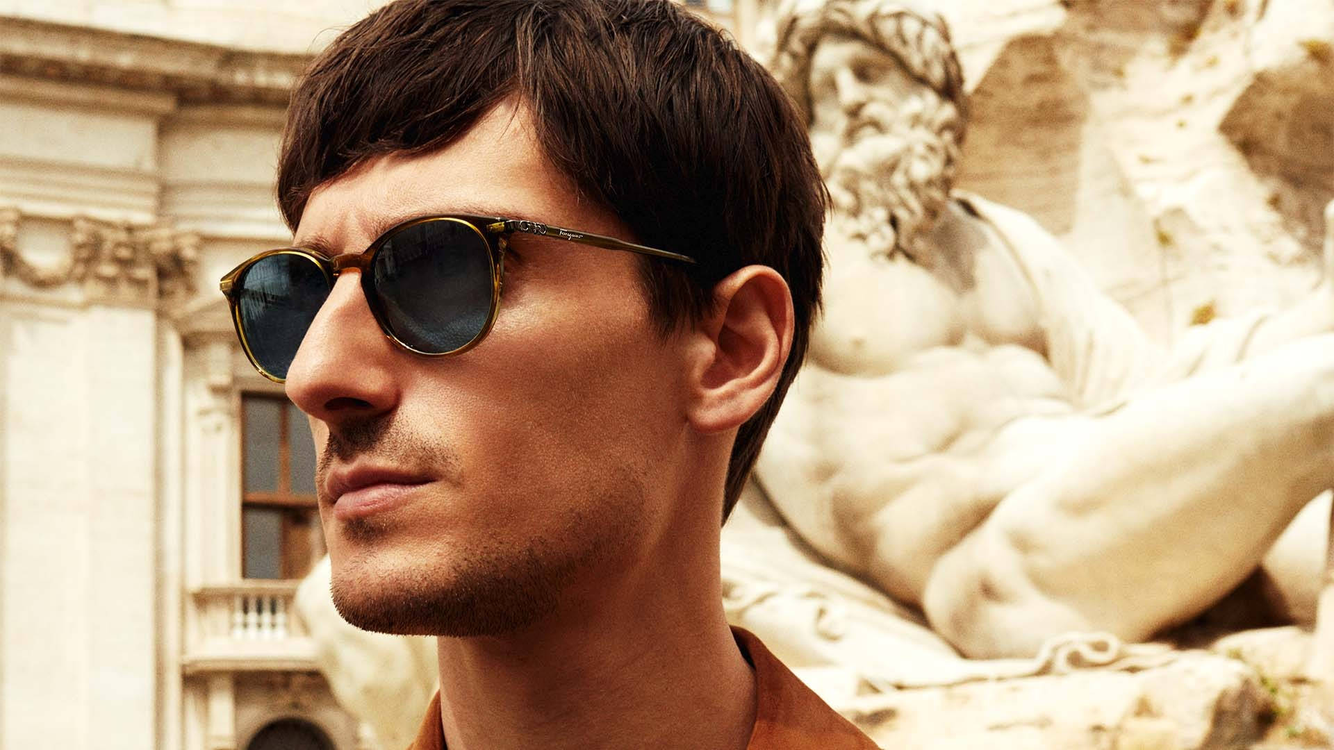 Caption: Show off a timeless look with Salvatore Ferragamo Oval Sunglasses. Wallpaper