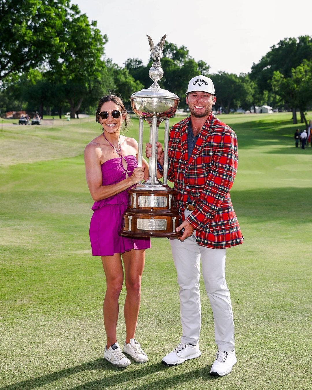 Sam Burns And Wife Holding Trophy Wallpaper