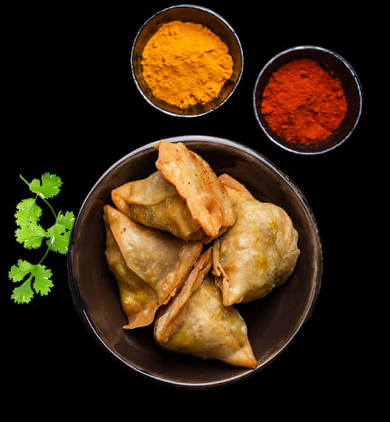 Samosaswith Spiceson Black Background PNG