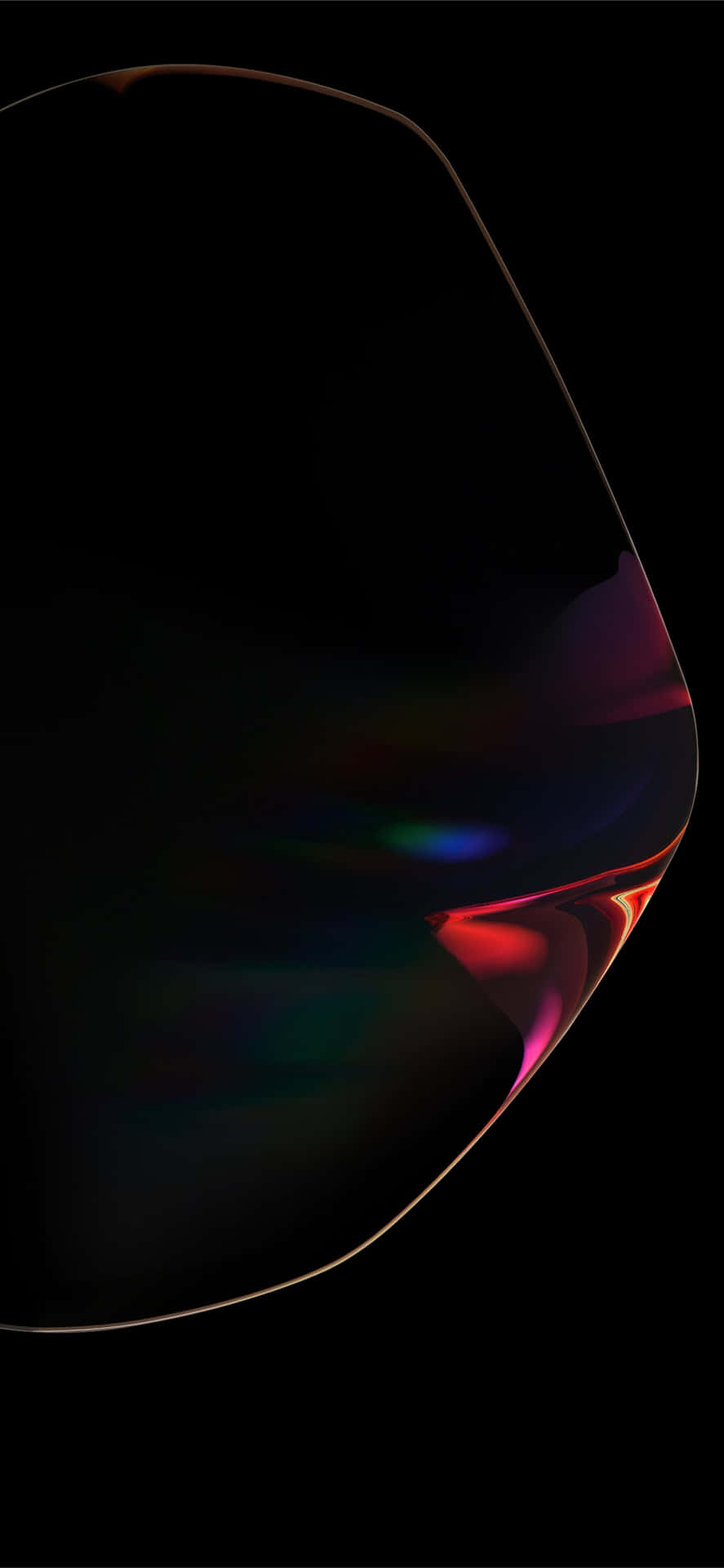 Et nærbillede af et sort objekt med et regnbuefarvet lys, der reflekteres væk fra det. Wallpaper