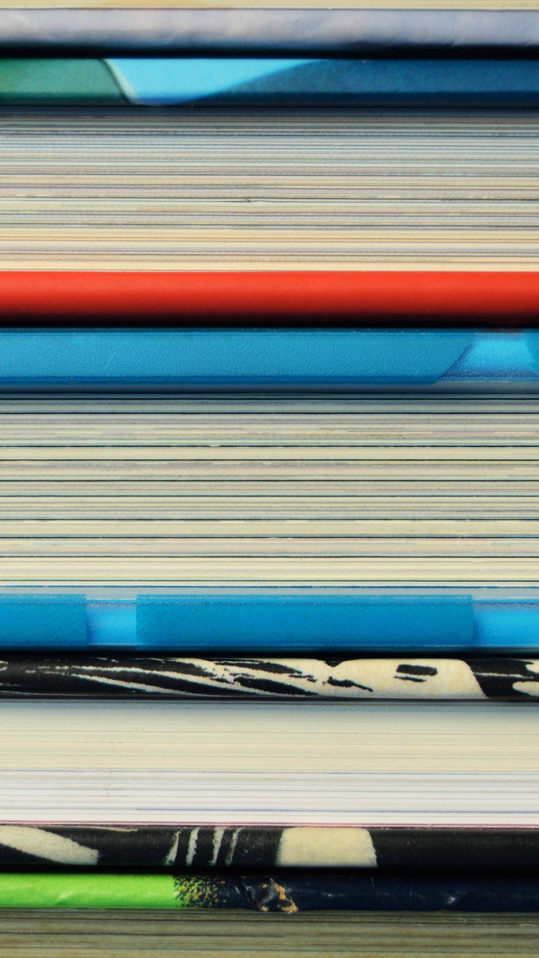 Samsung Galaxy S7 Edge Displayed on a Stack of Books Wallpaper