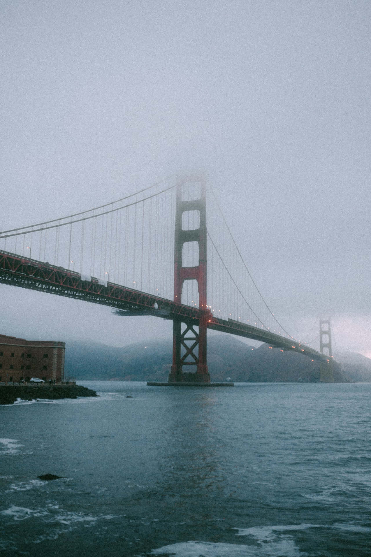 The Golden Gate Bridge shrouded in San Francisco fog Wallpaper