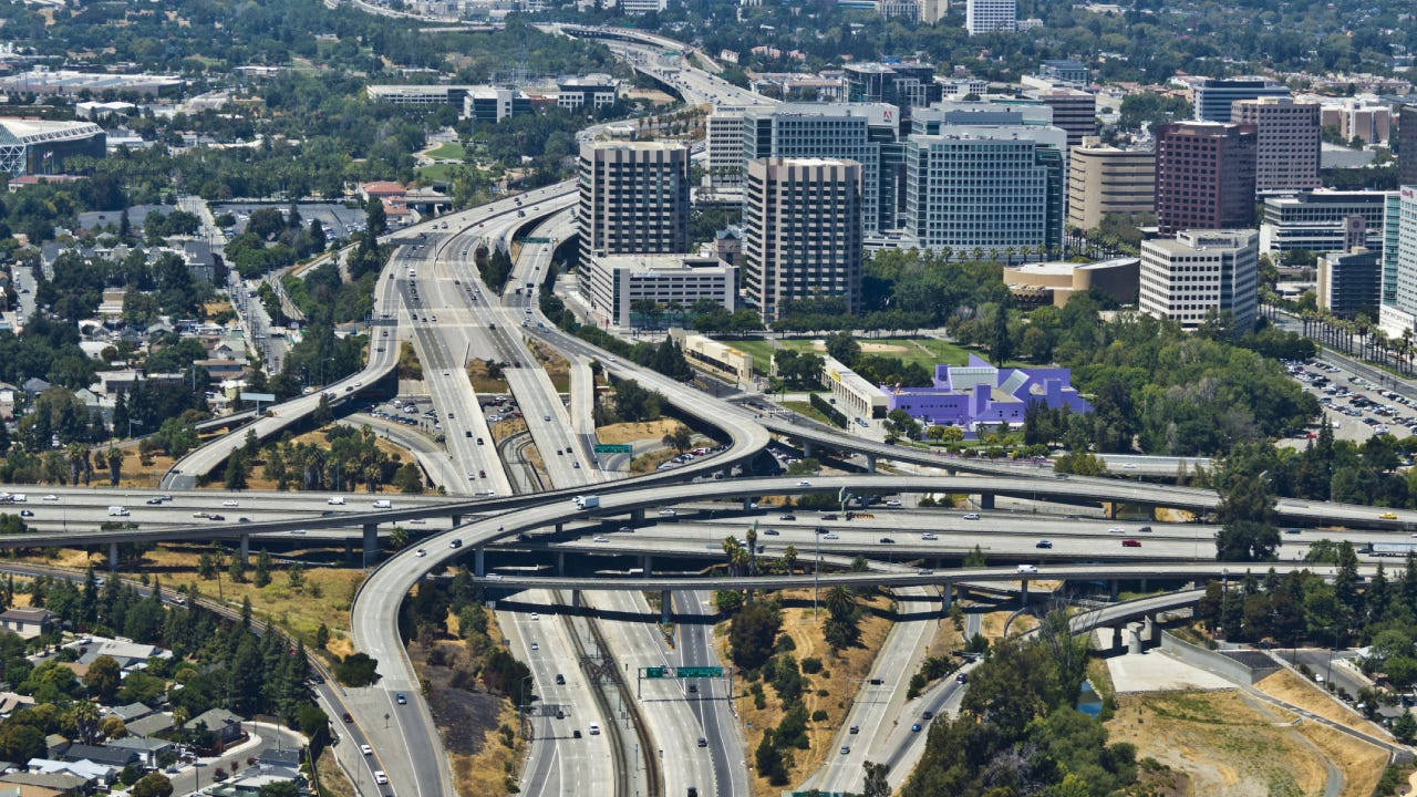 an aerial view of a highway and city Wallpaper