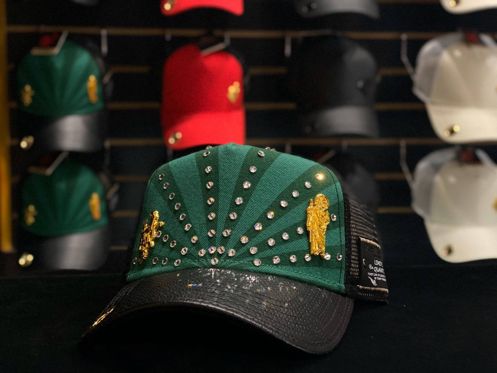 A Green And Black Hat With Gold And Black Studs Wallpaper