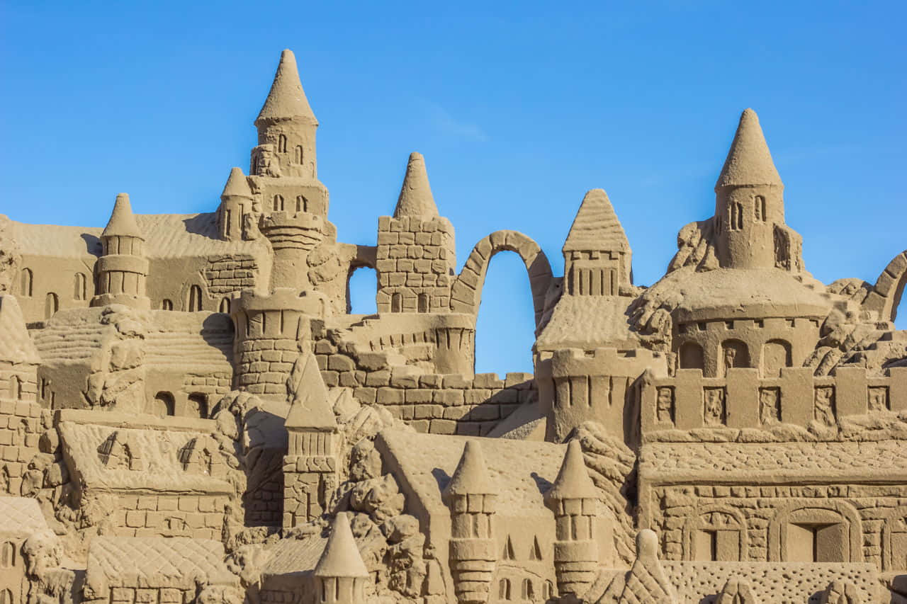 Create a breathtaking sand art design with careful consideration to shape and color.