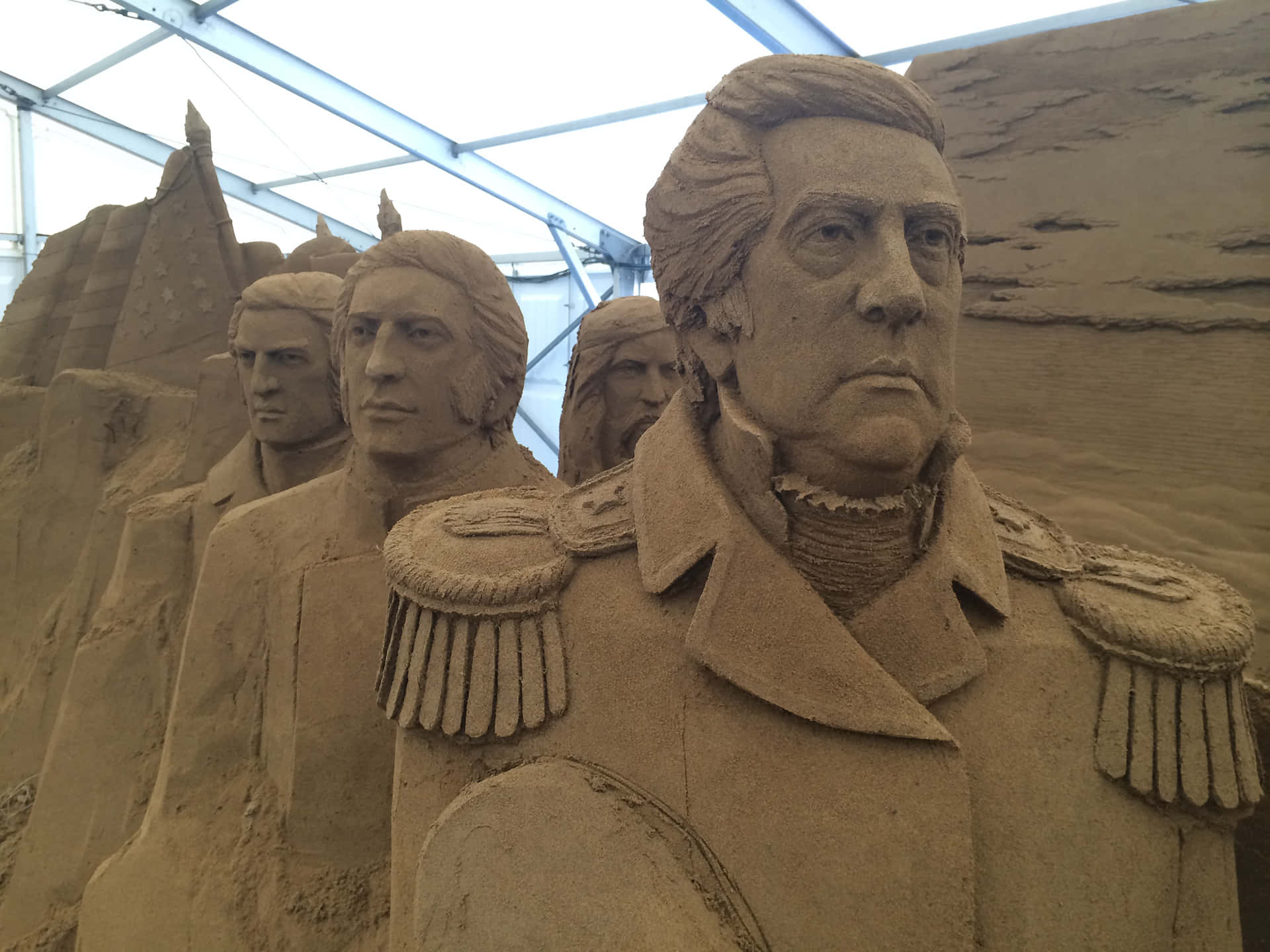 Sand Sculptures Of Men In Uniform
