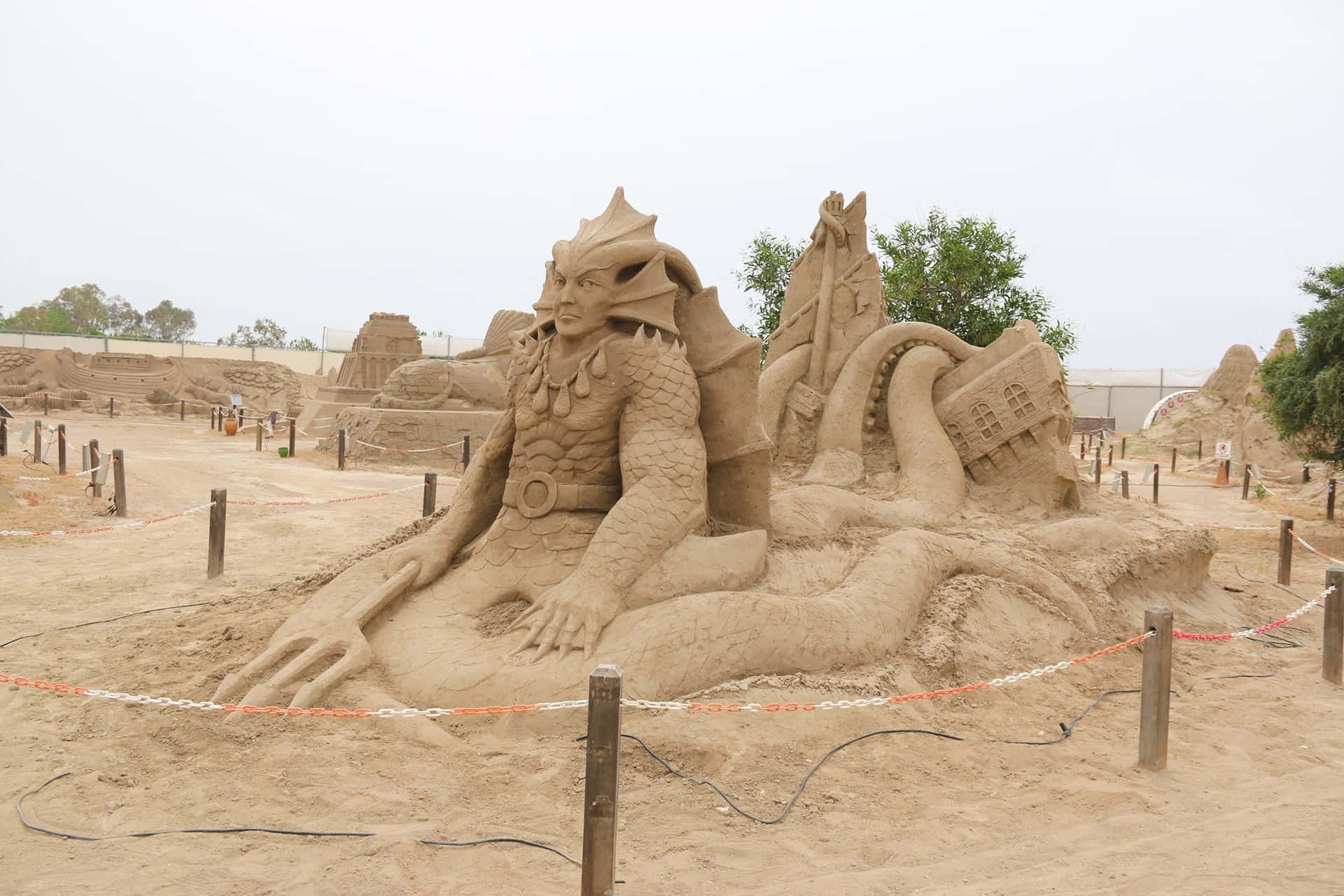 A Sand Sculpture Is On Display In A Desert