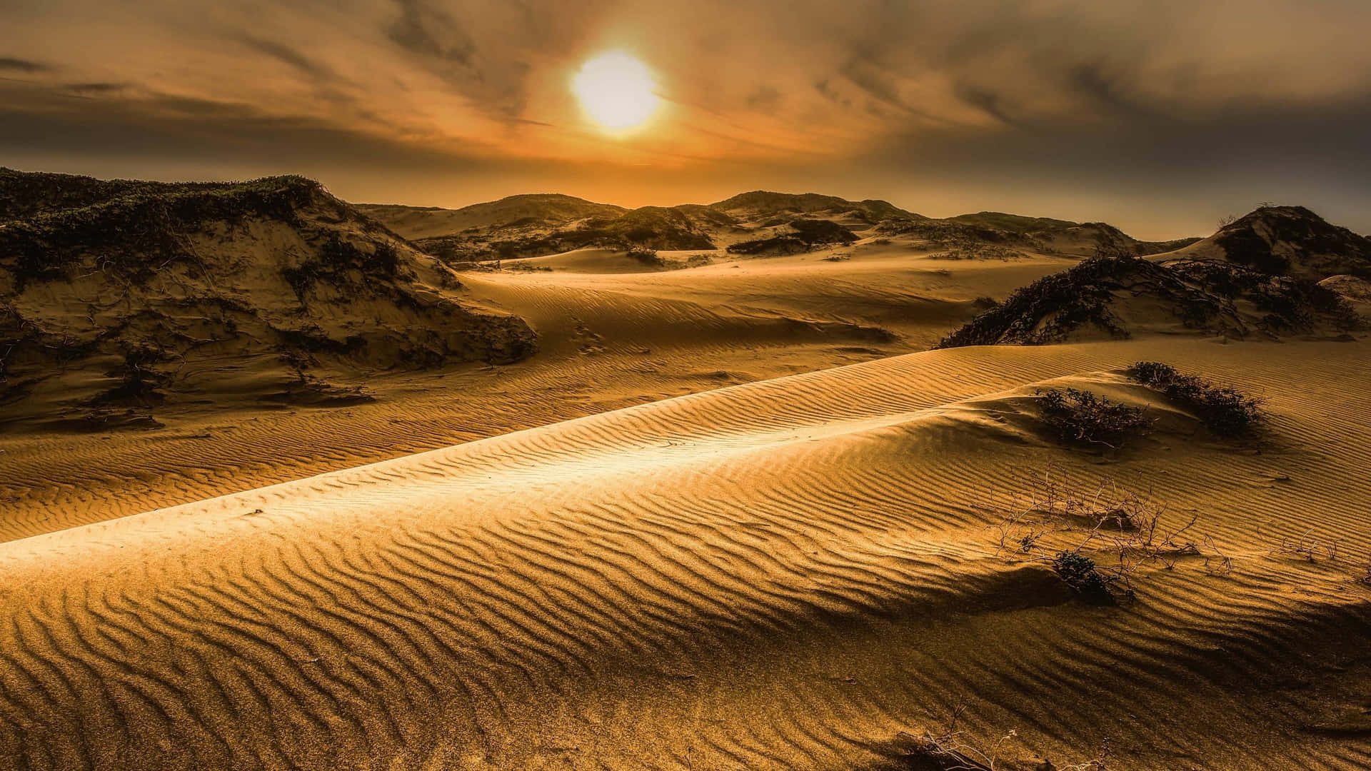 Majestic Sand Dunes Under Golden Sunset Sky Wallpaper