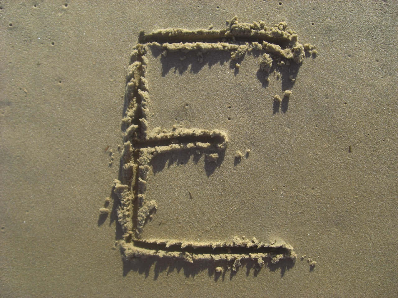 Sand Imprinted Capital E Wallpaper