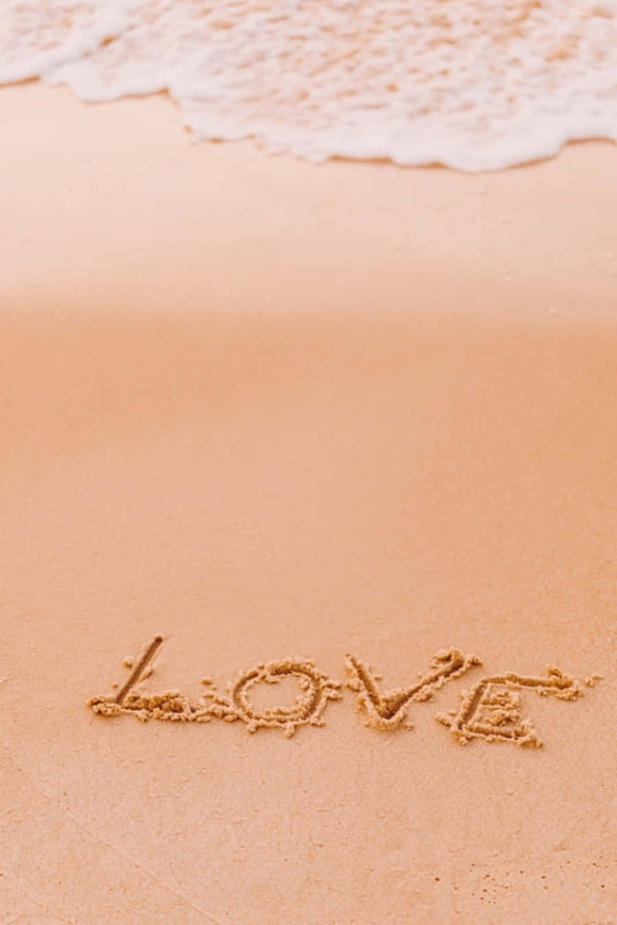 Amoredisegnato Sulla Sabbia Della Spiaggia