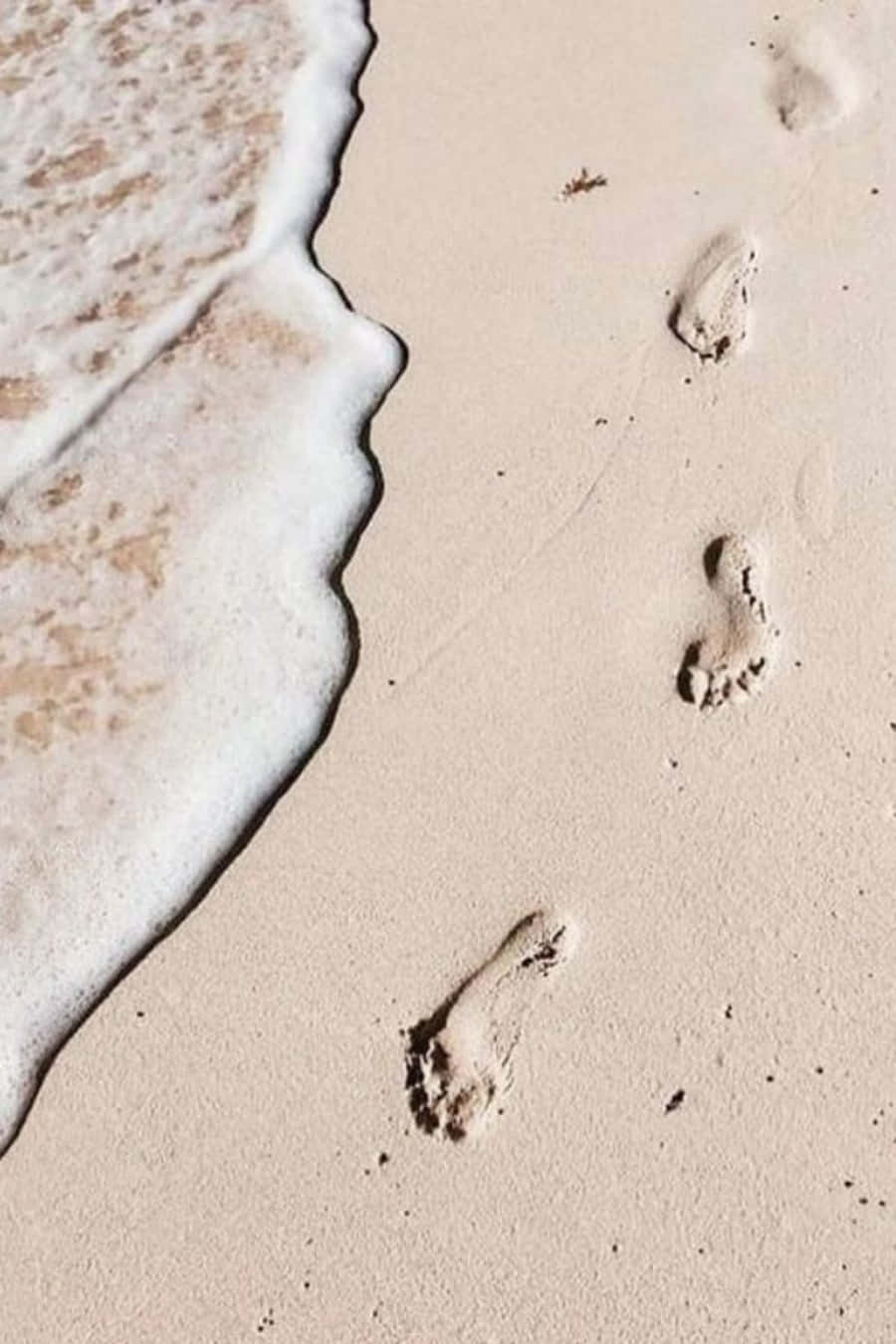 Fußspurenim Sandbild