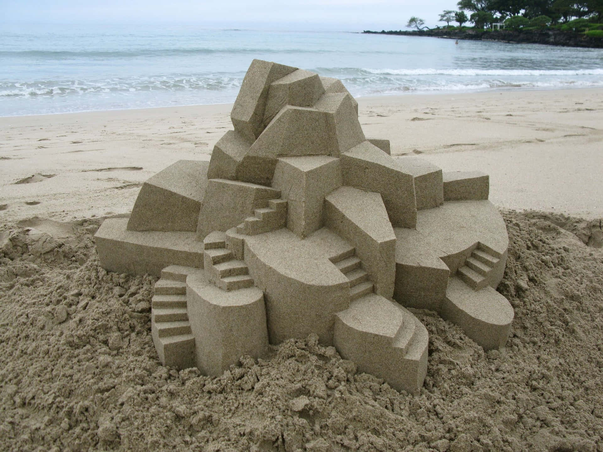Majestic Sandcastle on a Sunny Beach Wallpaper