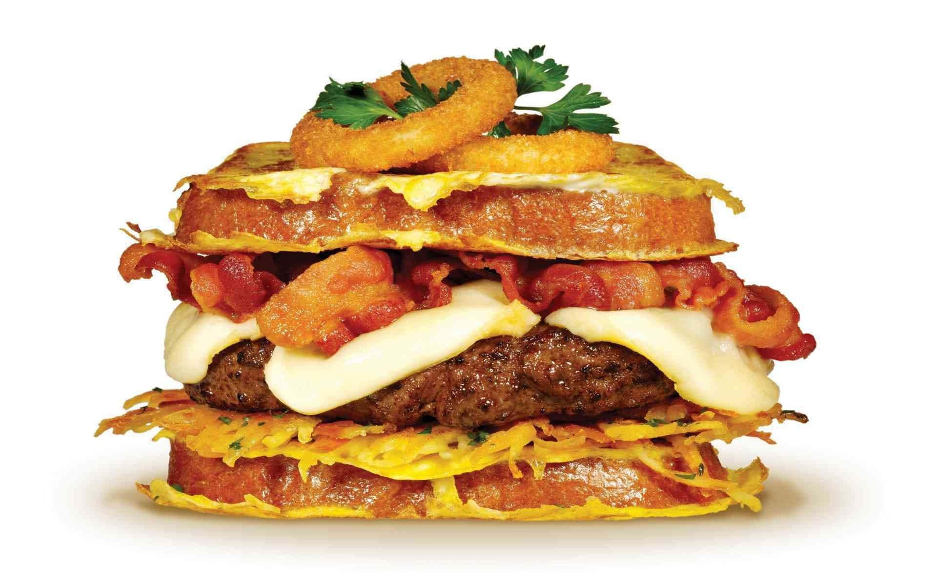 A Burger With Bacon And Cheese On Top