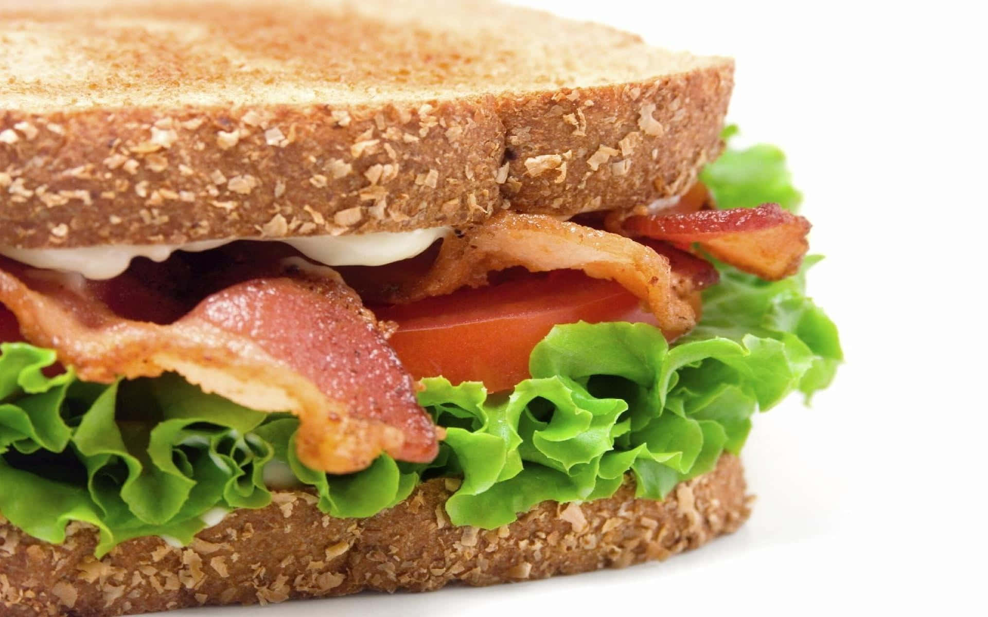 A Sandwich With Lettuce, Tomatoes And Bacon