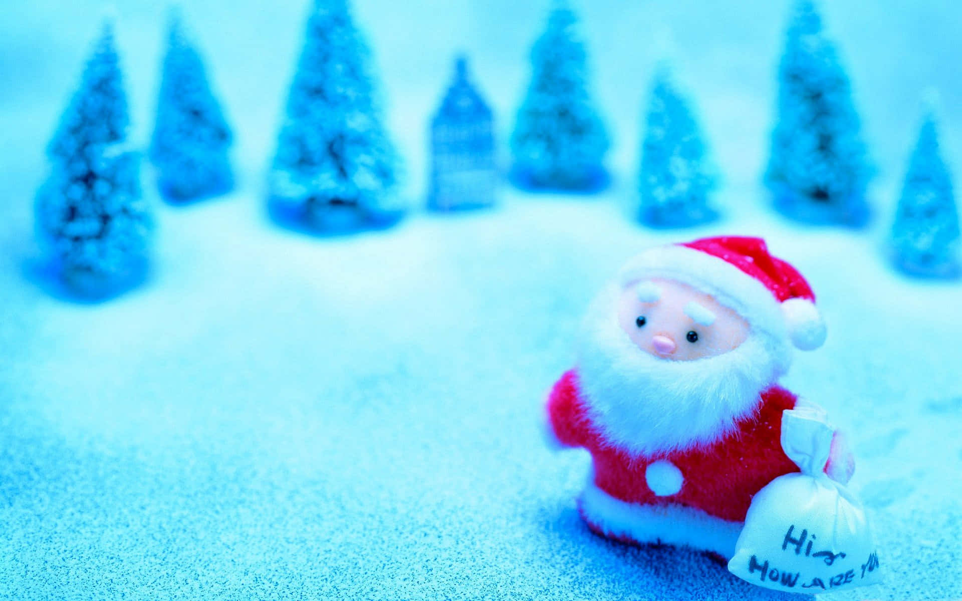 Santa Claus happily holding a bag full of gifts in a snowy setting.