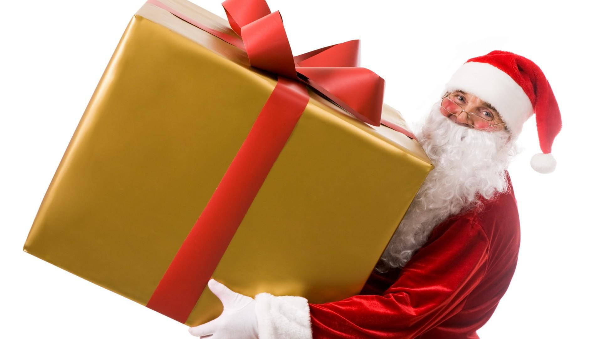 Santa Claus Holding Gift Box Wallpaper