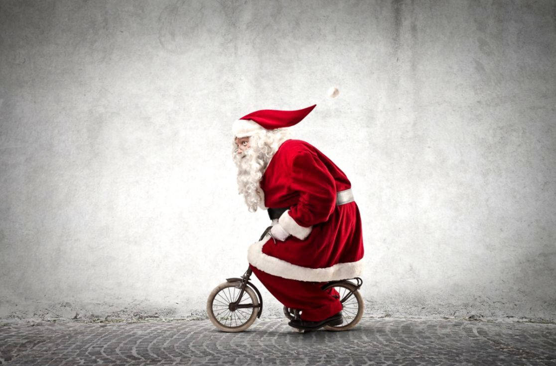 Santa Claus Riding Bicycle Funny Christmas Wallpaper
