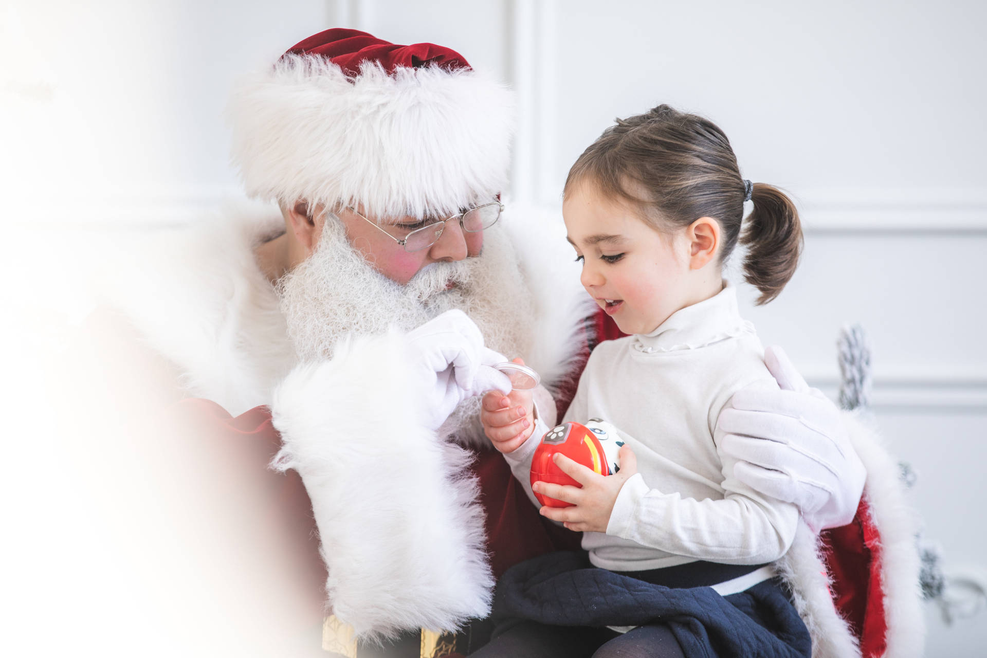 Santa Giving Toy To A Girl Wallpaper
