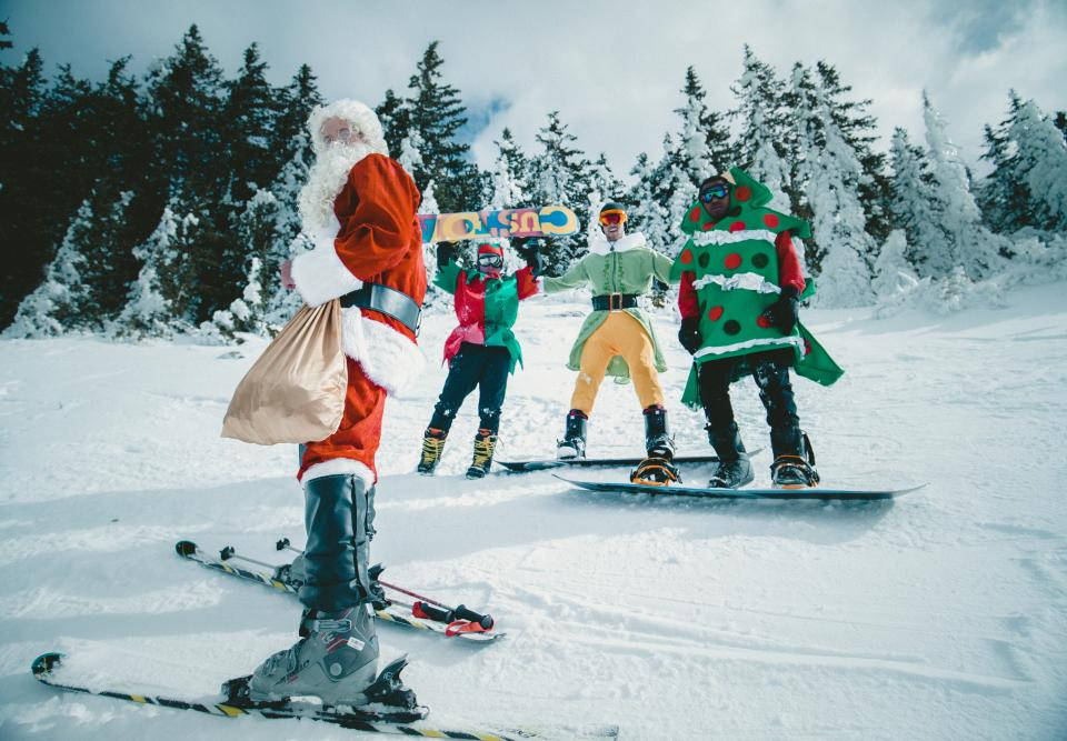 Santa Skiing On White Snow Wallpaper