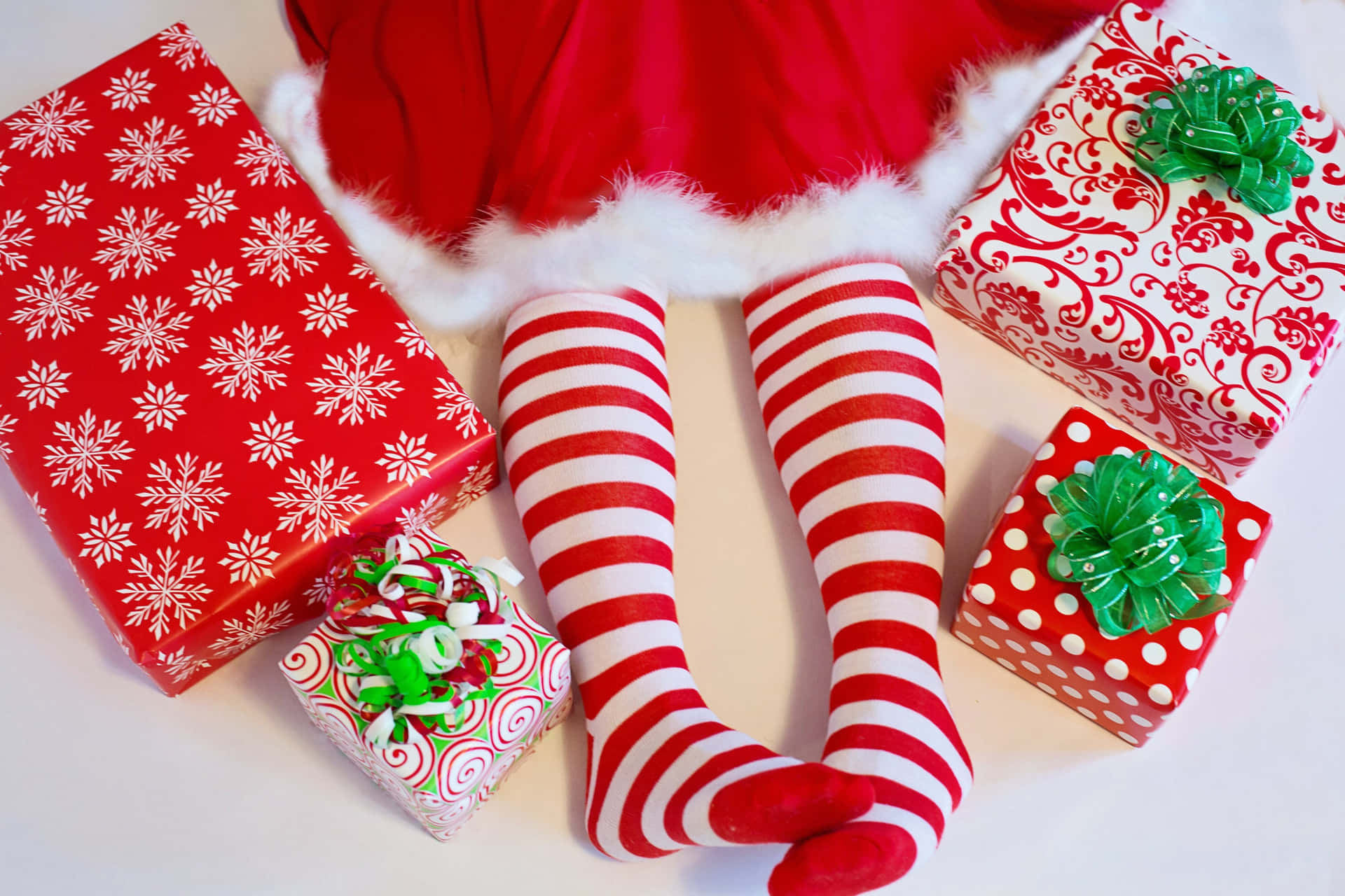 Santa Striped Legs With Gifts.jpg Wallpaper