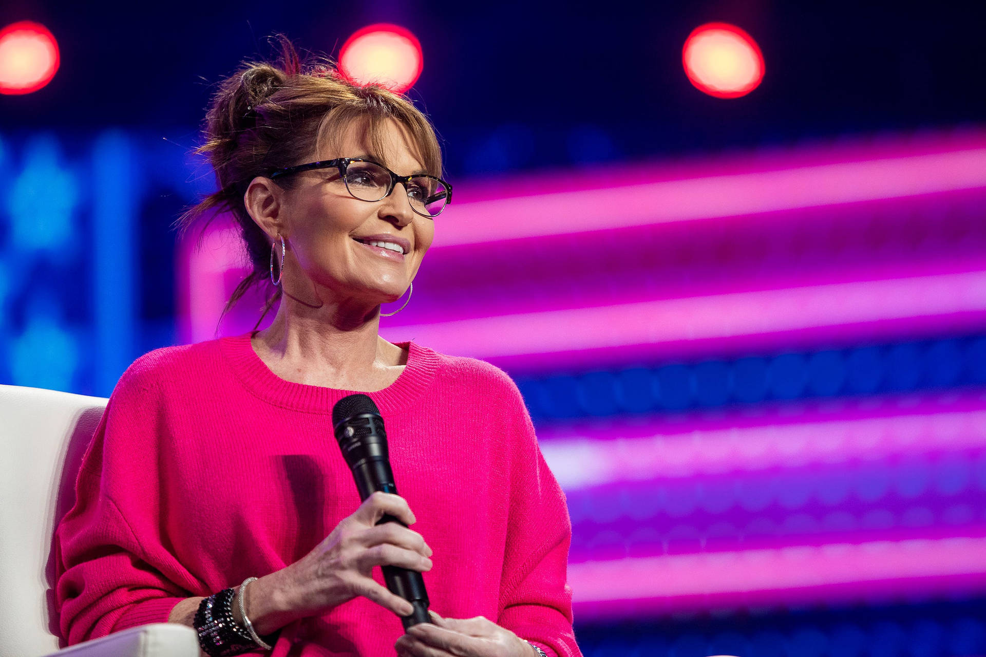Sarah Palin Smiling While Holding Microphone Wallpaper