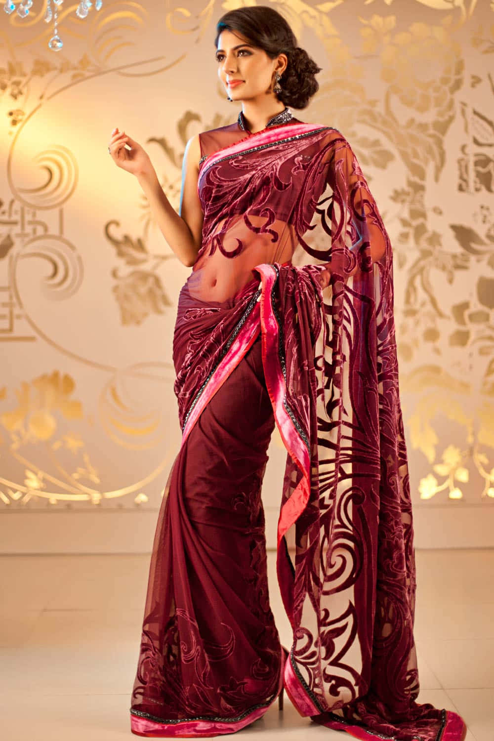 This graceful woman is wearing an elegantly draped saree.