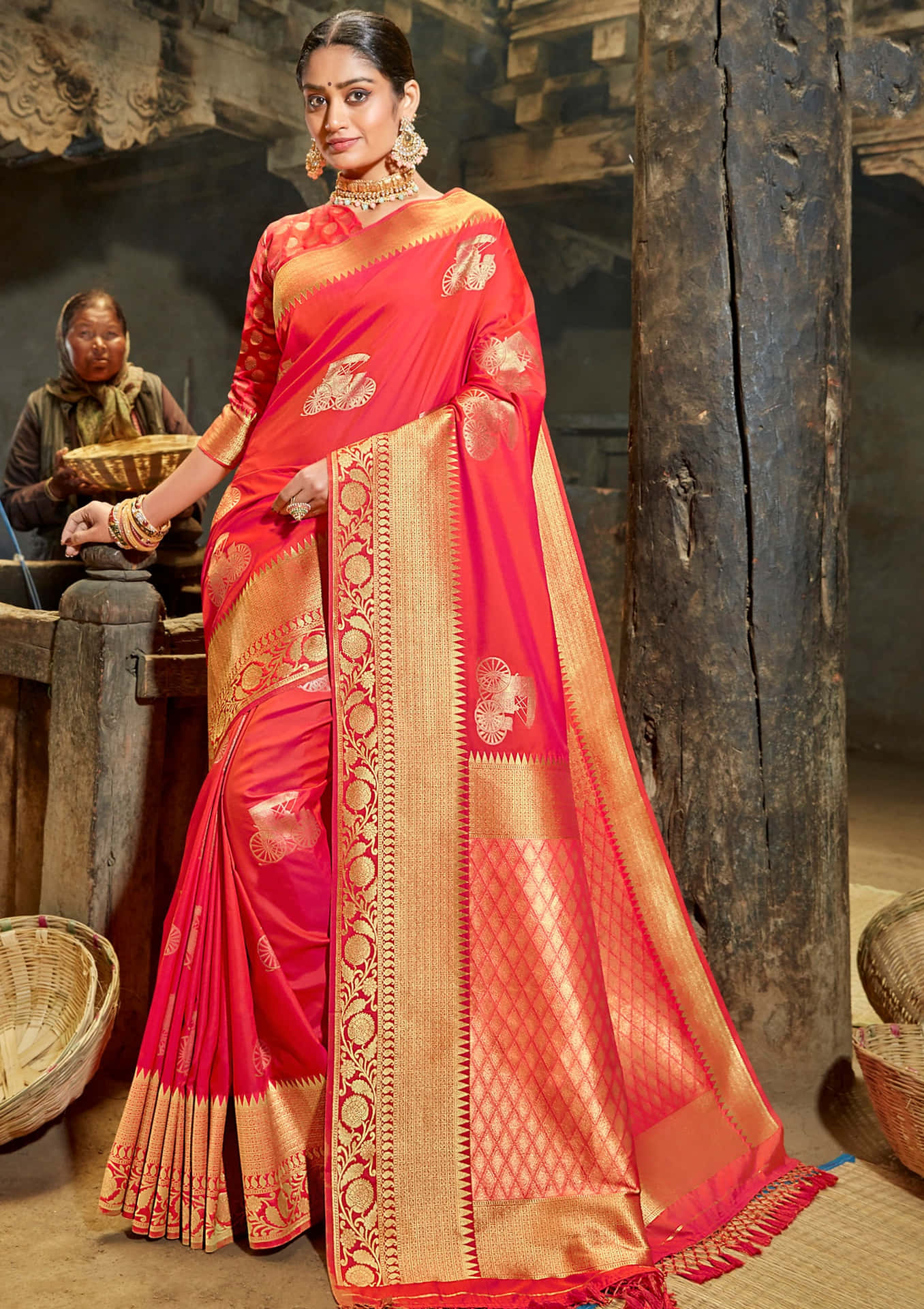 A woman celebrating her culture by wearing a vibrant saree.