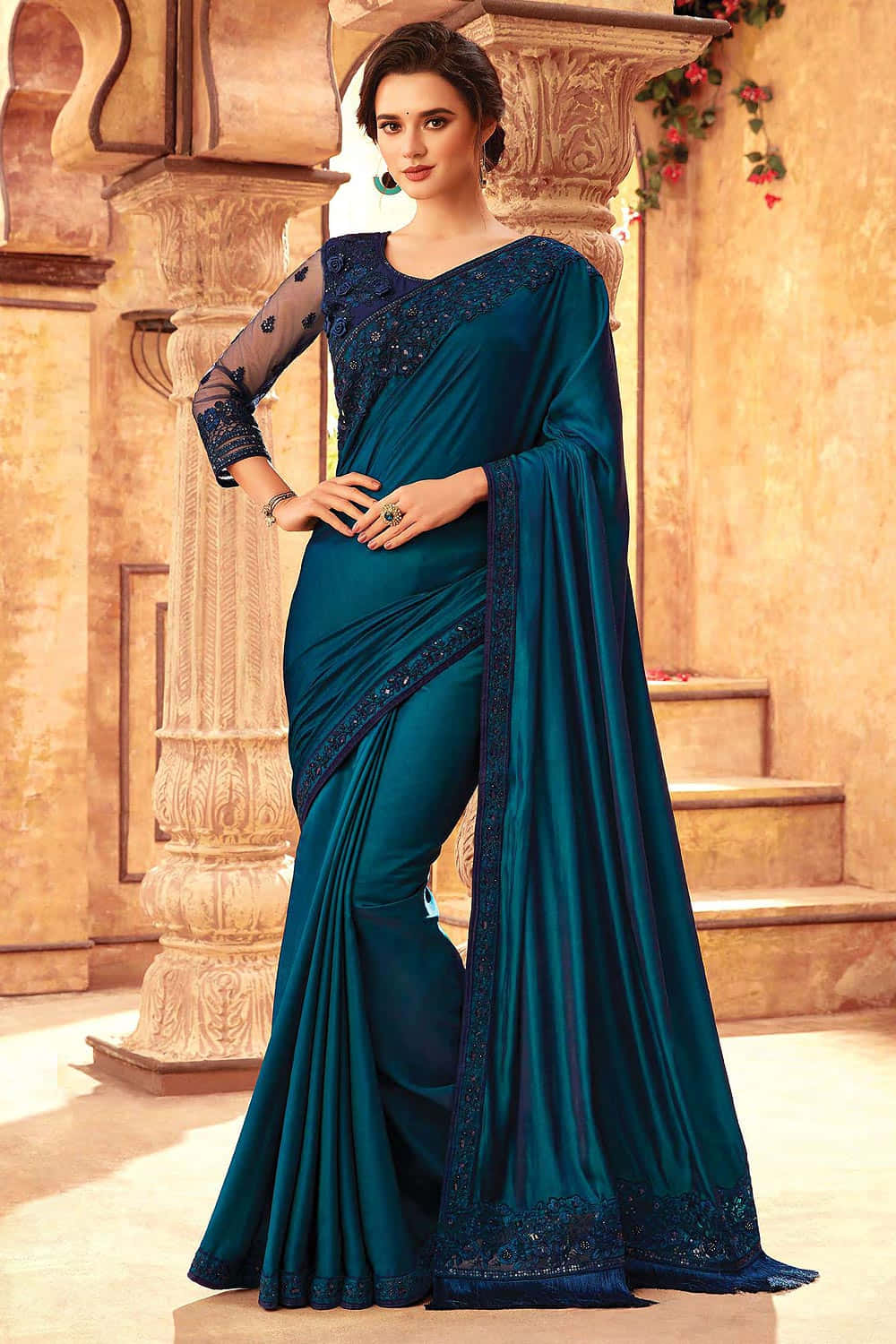 She is dressed flawlessly in a stylish saree