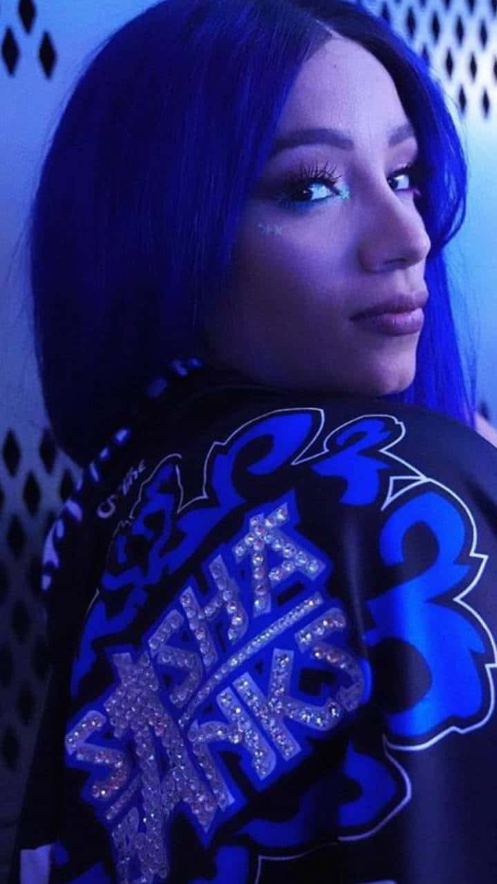 Unamujer Con Cabello Azul Está Posando Para Una Foto Fondo de pantalla