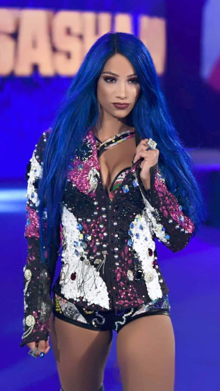 A Woman With Blue Hair On Stage Wallpaper