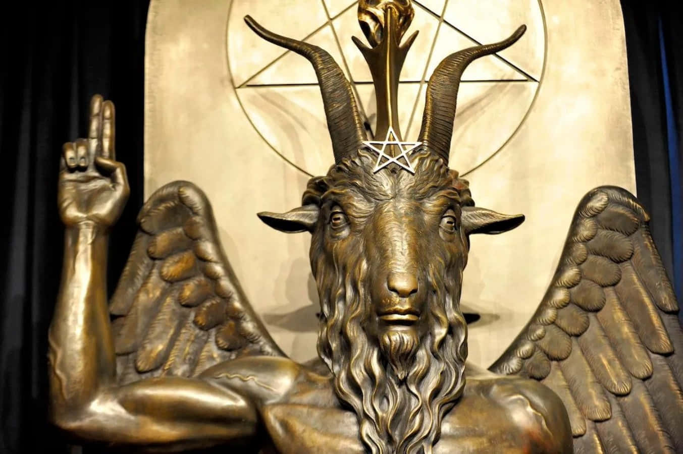 A Statue Of A Goat With Horns And A Pentagram
