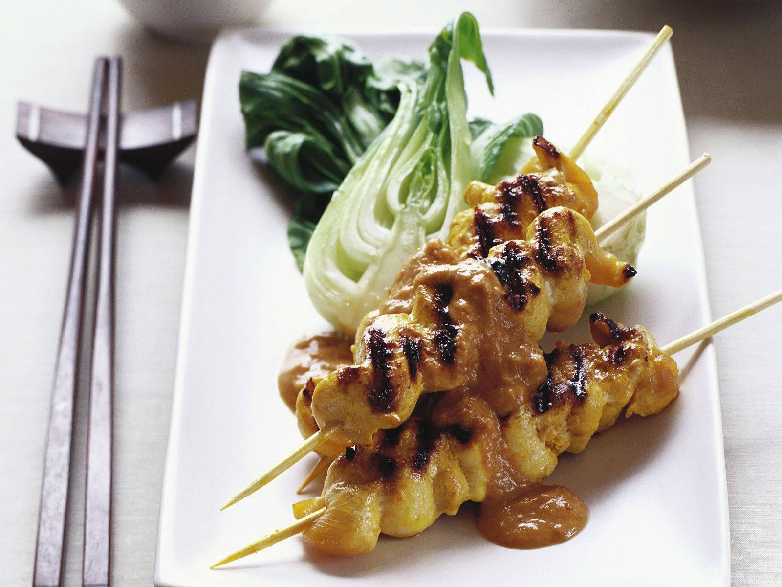 Satay With Bok Choy Vegetables And Chopsticks Wallpaper