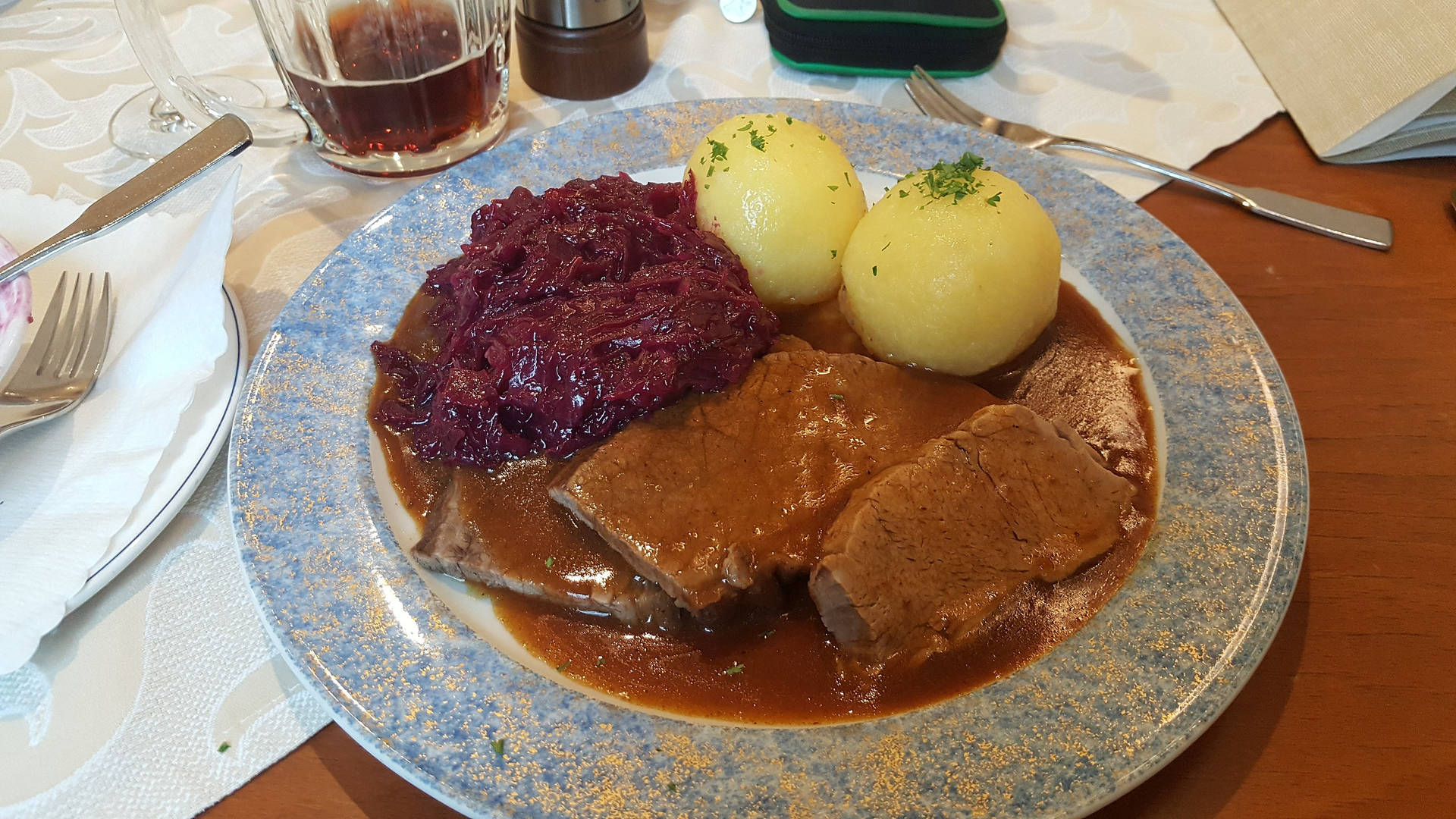 Sauerbraten Creamy Sauce With Red Cabbage And Dumplings Wallpaper