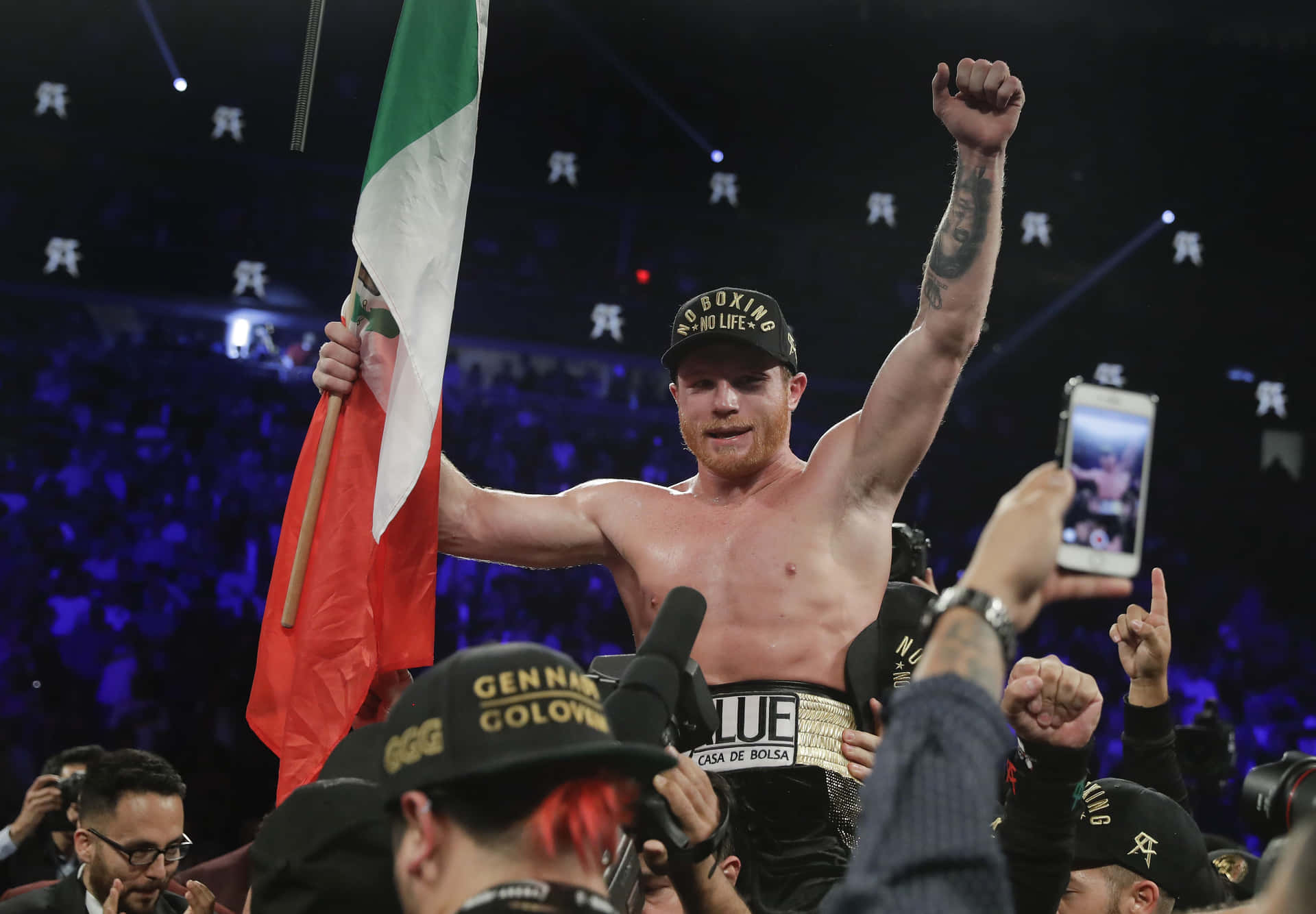 Saul Canelo Alvarez Holding The Flag Of His Country Wallpaper