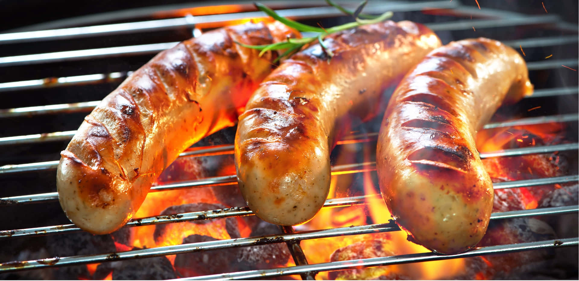 Sausages On A Grill With Flames