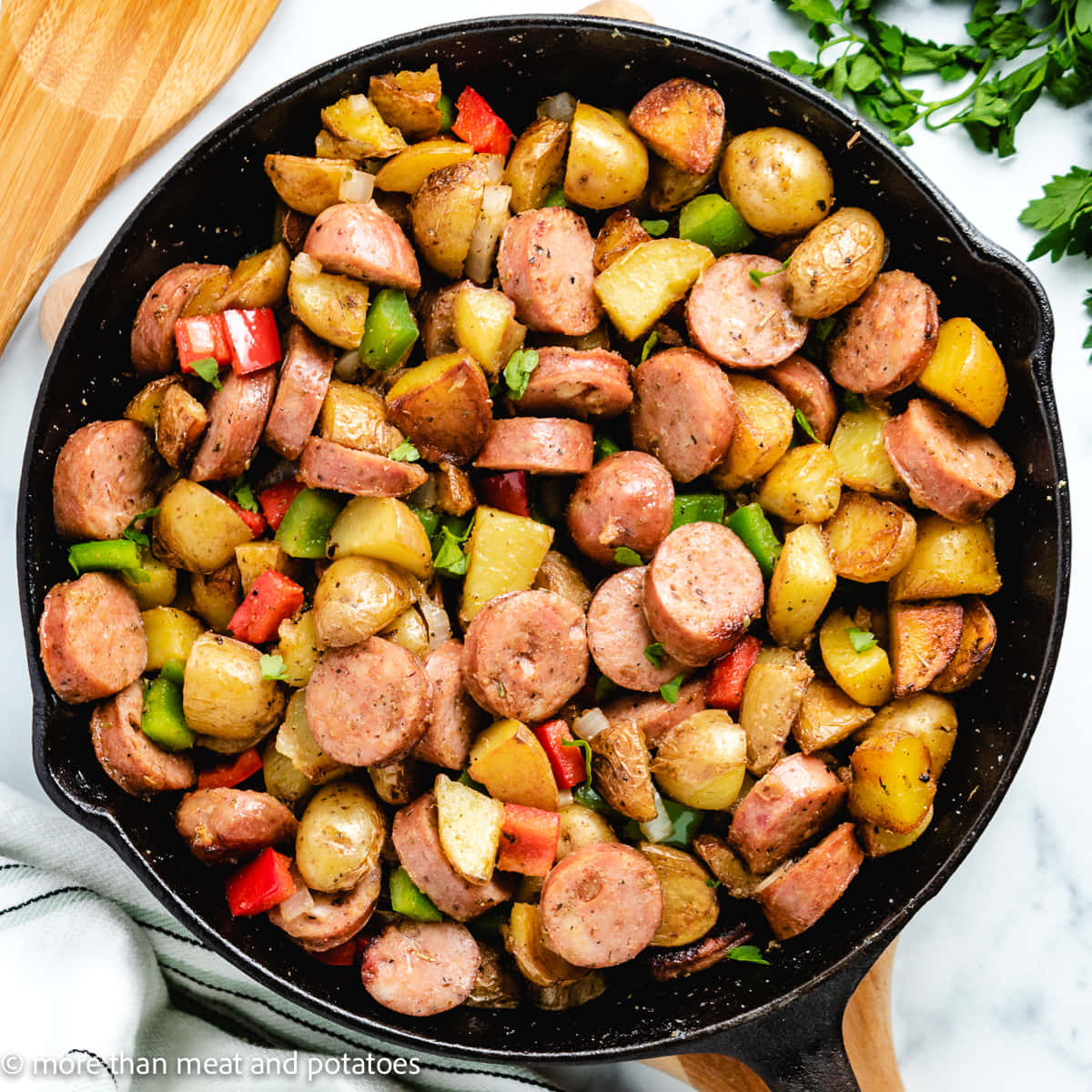 A Skillet With Potatoes And Sausage