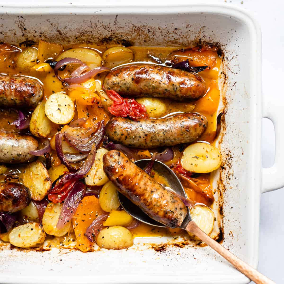 Sausages And Potatoes In A Baking Dish