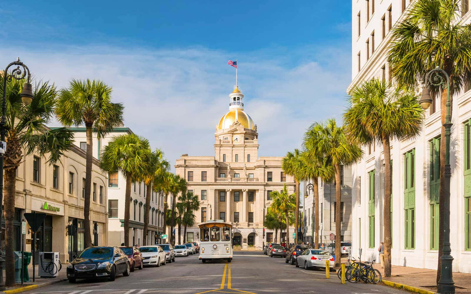Charleston, South Carolina - A City With Palm Trees And A Tall Building