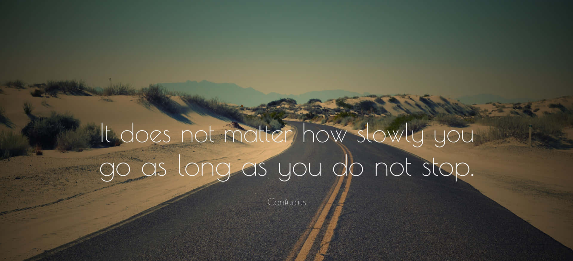 A Road With A Quote Saying Does Not Matter How You Go As Long As You Do Not Stop Wallpaper