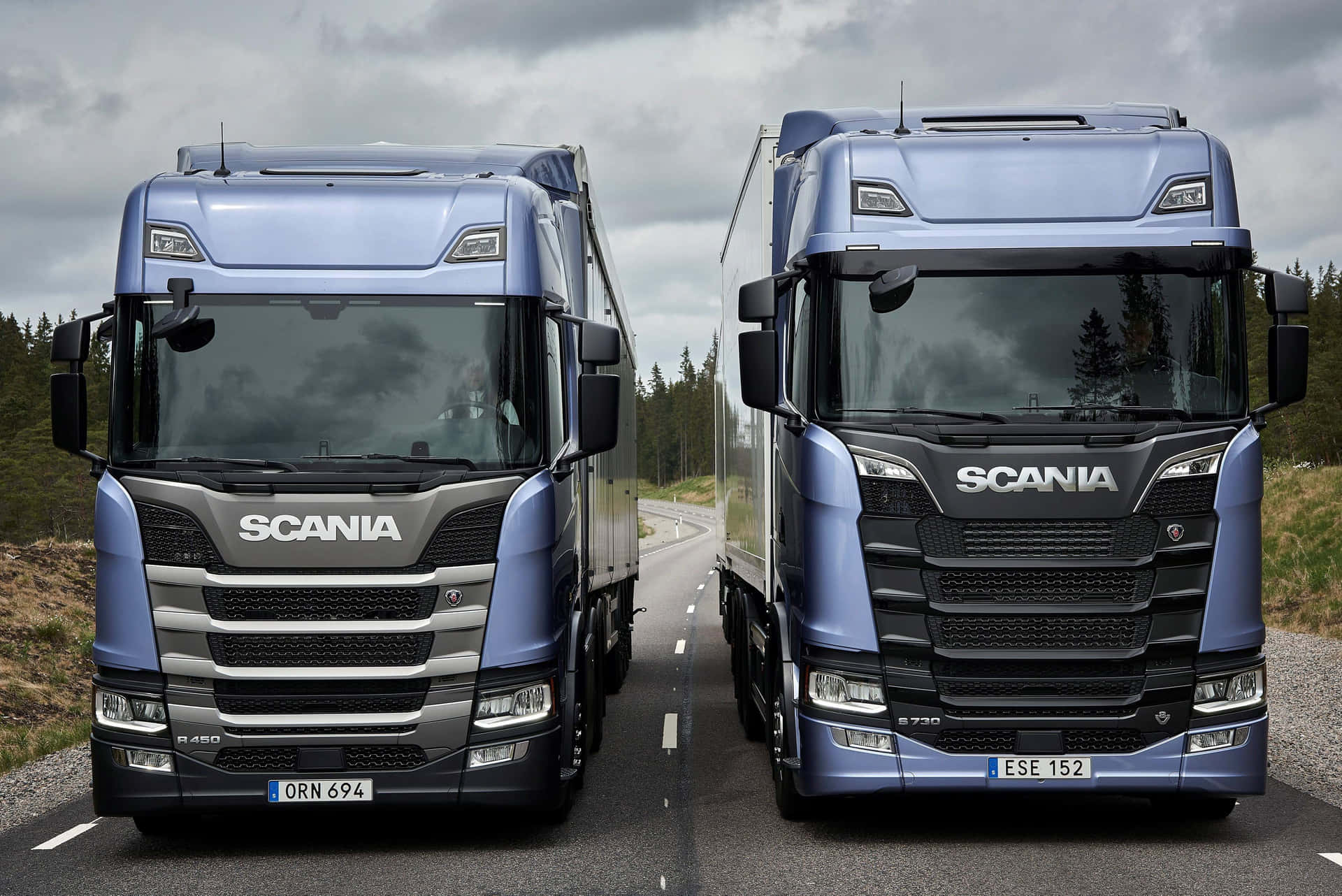 Scania Trucks Sideby Sideon Road Wallpaper