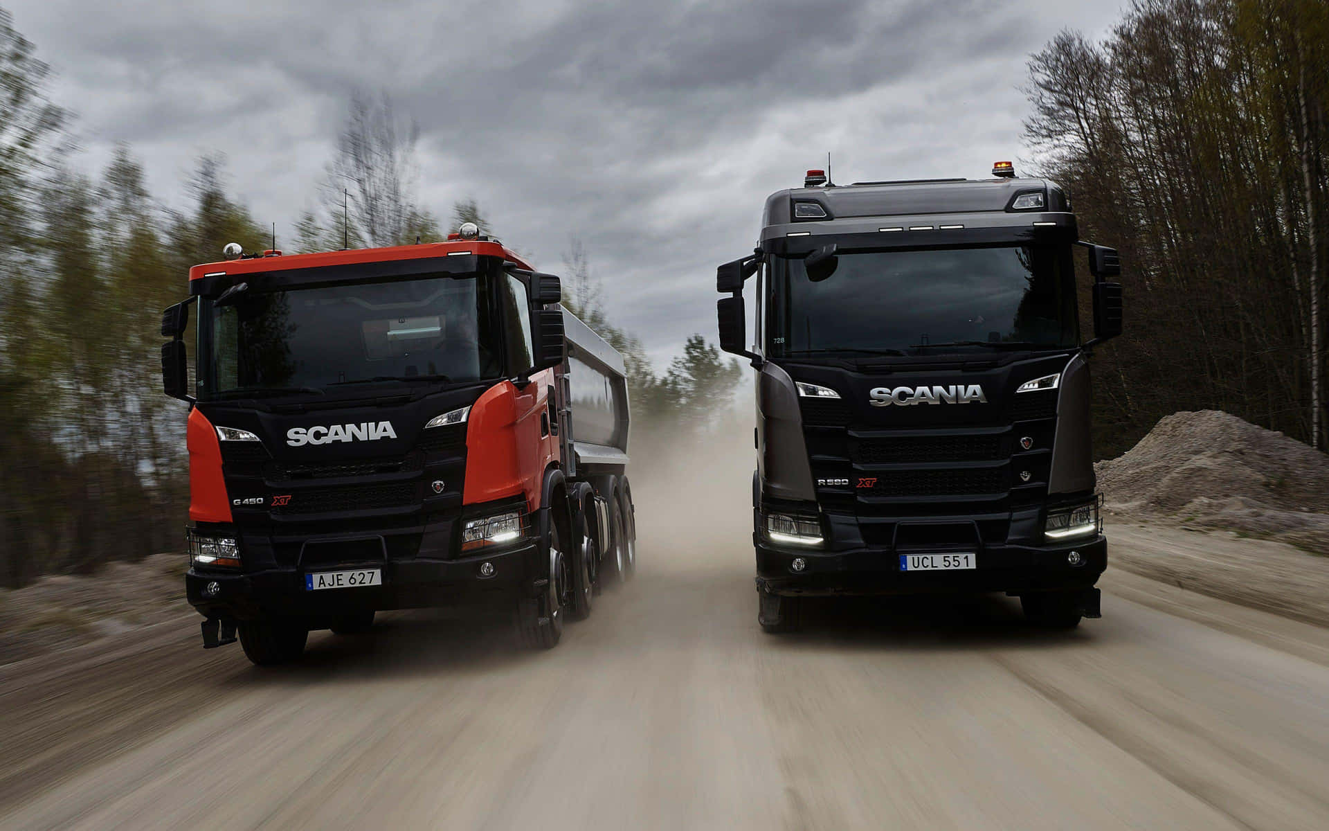 Scania Trucks Speedingon Dirt Road Wallpaper