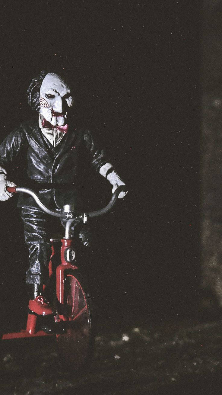 A Clown Riding A Bike Wallpaper
