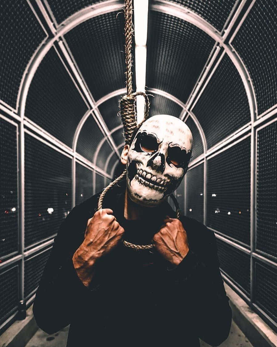 a man holding a skeleton