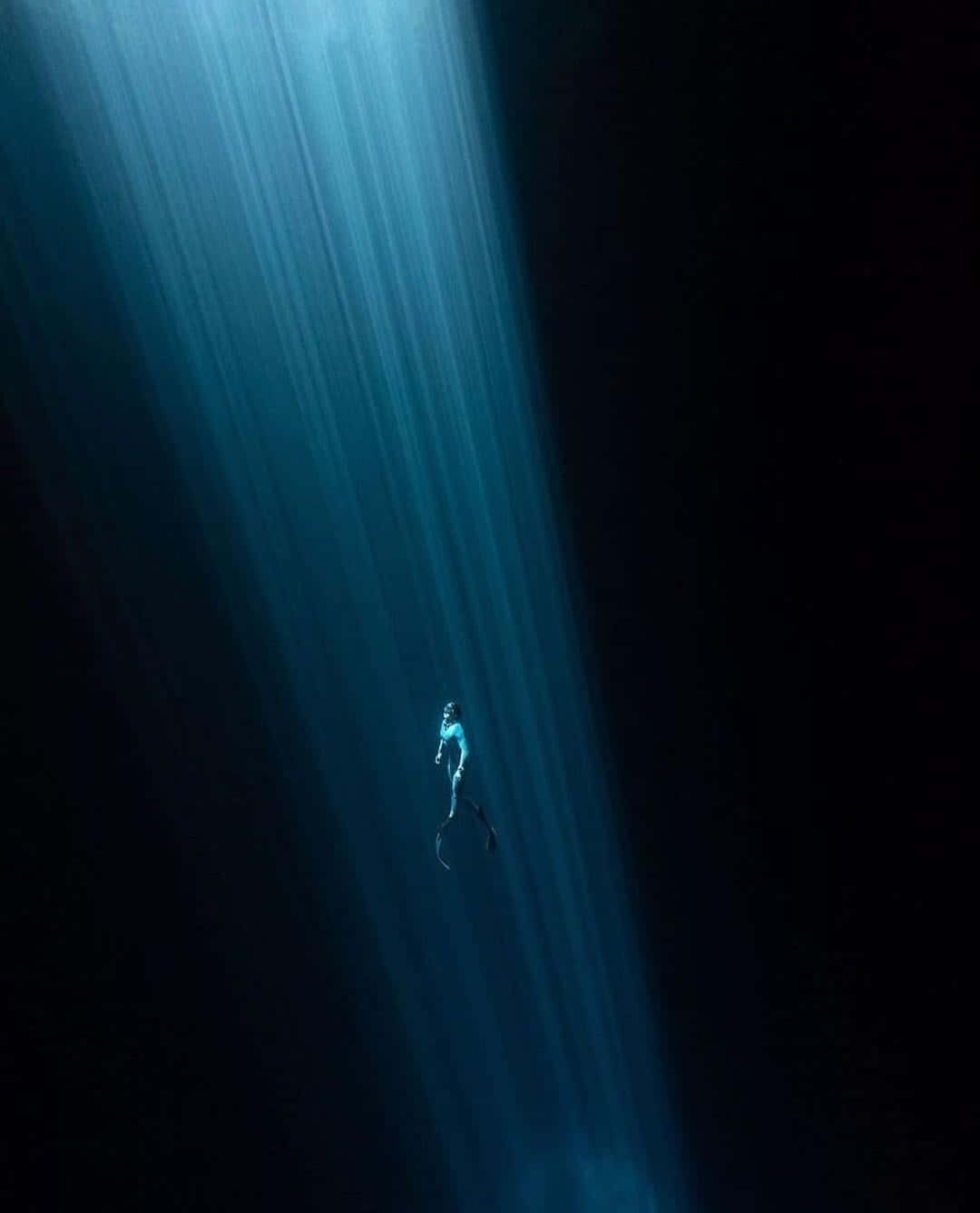 Something scary is lurking beneath this dark, mysterious underwater landscape.